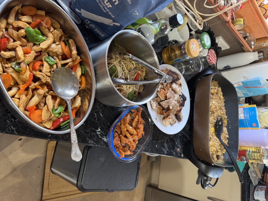 Photo of a Chinese meal - Cantonese chicken, Longevity beef noodles, lemon chicken, Cantonese roast pork belly and fried rice.