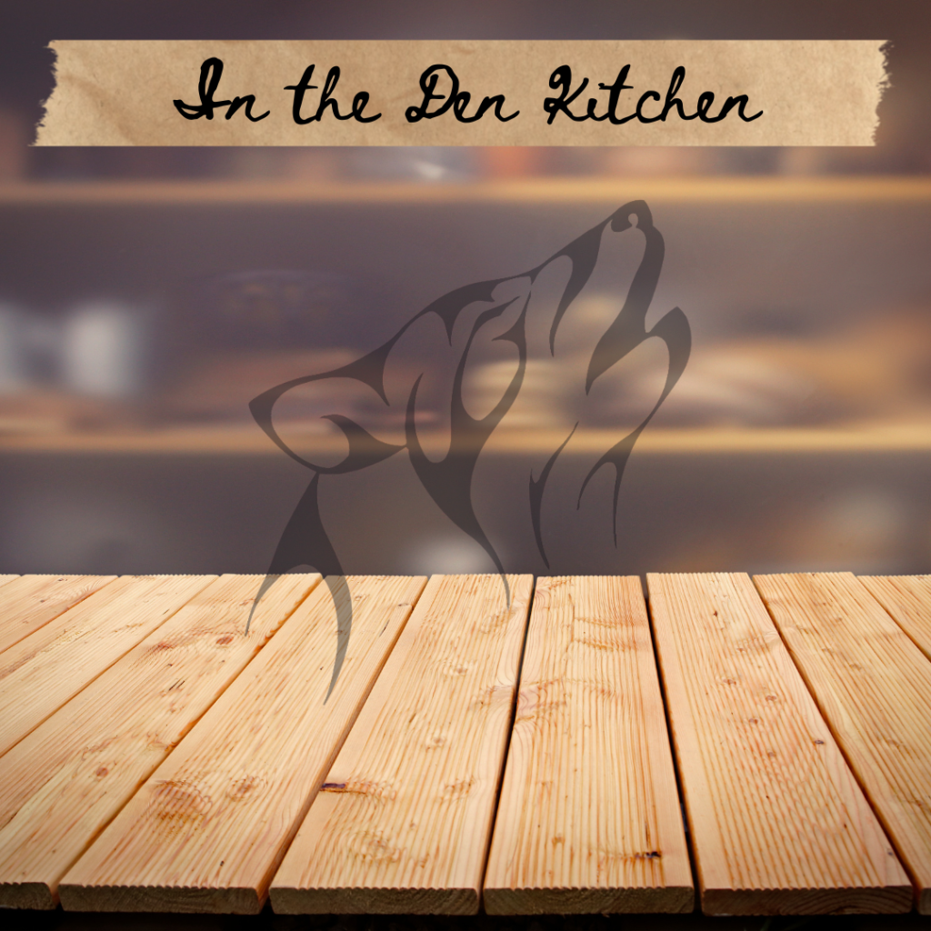 Burred image of a kitchen with the words In the Den Kitchen