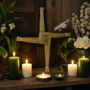 Homemade Brigid’s Cross on altar with green and white candles